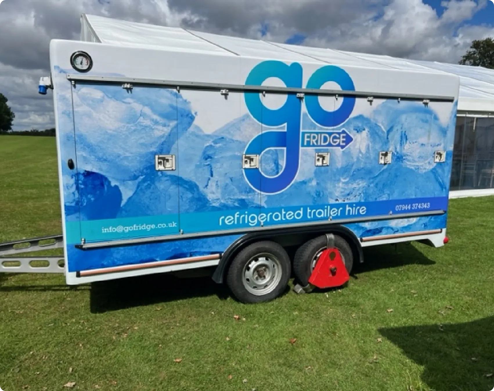Side view of a mobile refrigeration trailer with doors closed, highlighting secure, portable cold storage ideal for refrigeration hire, events, catering, and commercial use.